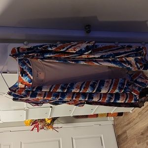 Colorful over shirt and cream under tank with lace bottom.